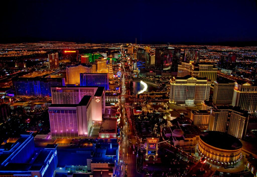 las-vegas-nevada-cities-urban-161772-161772 Stunning aerial view of Las Vegas Strip glowing at night with vibrant neon lights and bustling nightlife.