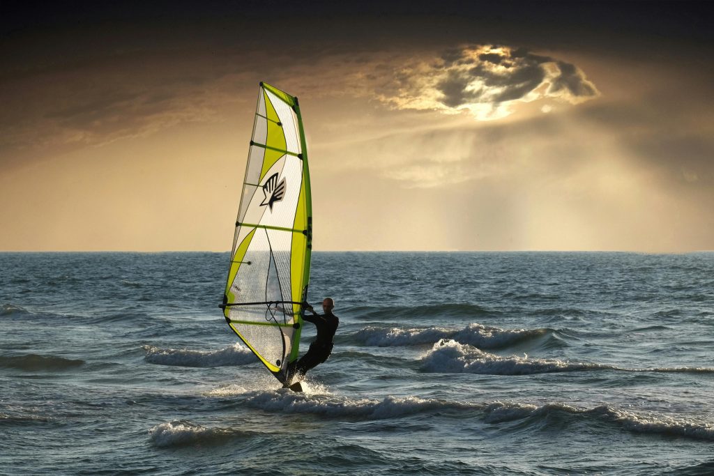 pexels-photo-414247-414247 Exciting windsurfing action against a dramatic sunset seascape. Perfect for adventure and travel themes.